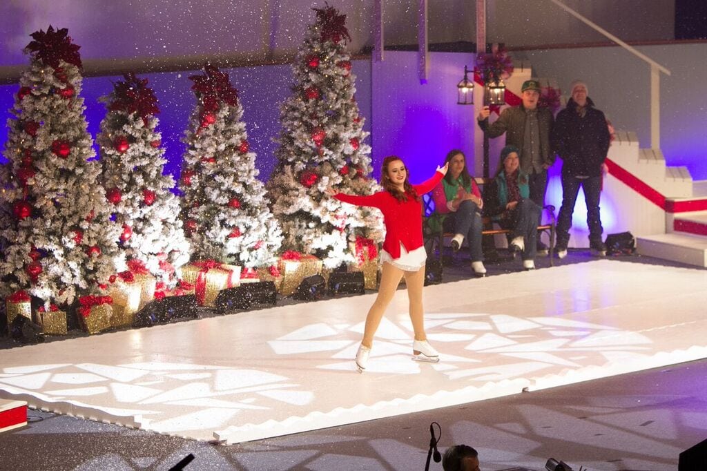 A woman ice skating on stage