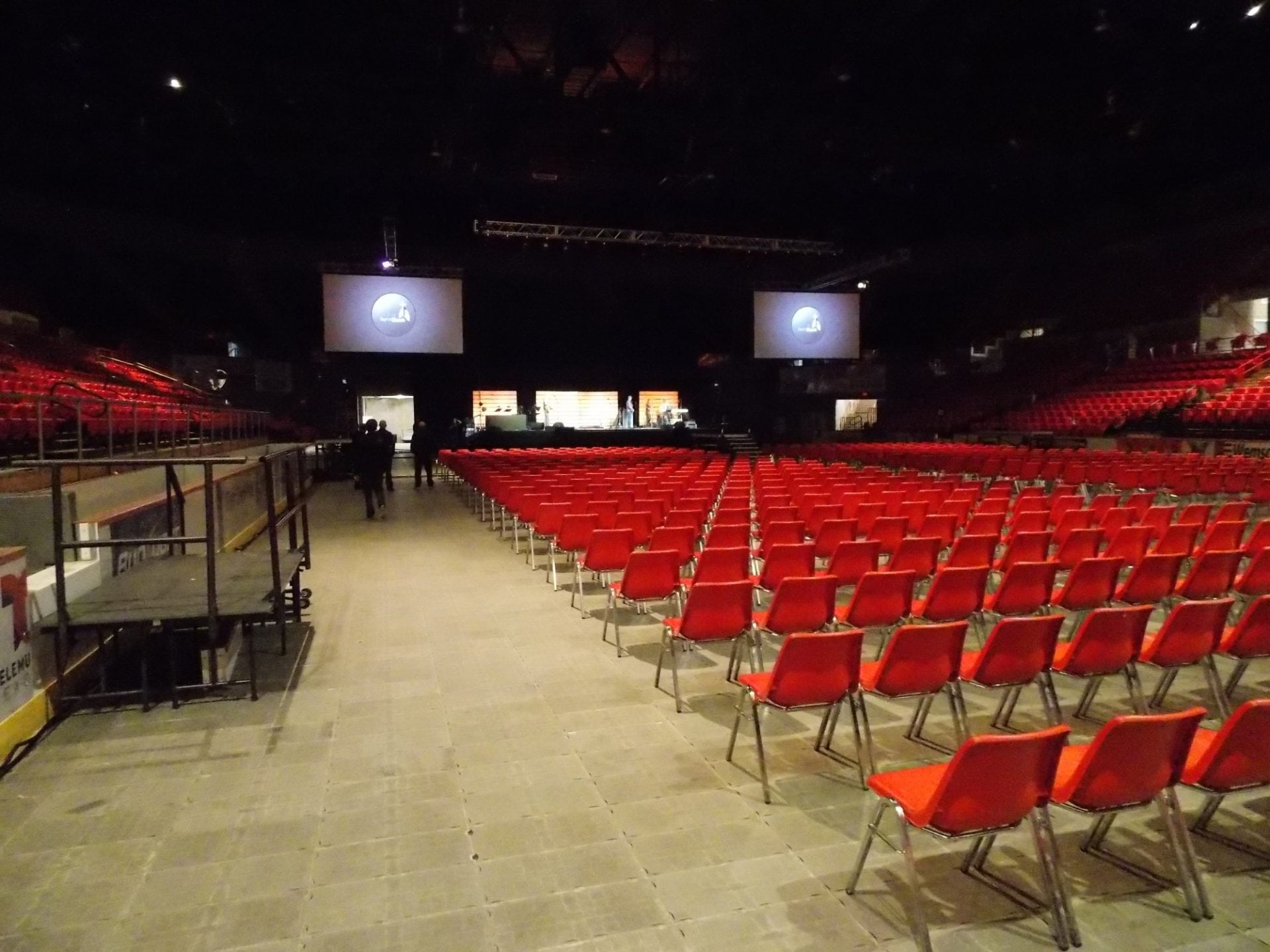 A room full of red chairs