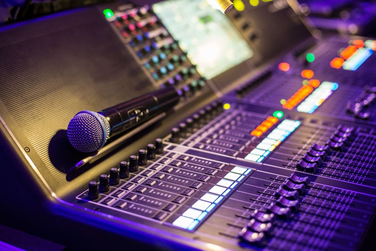 A microphone on top of a soundboard